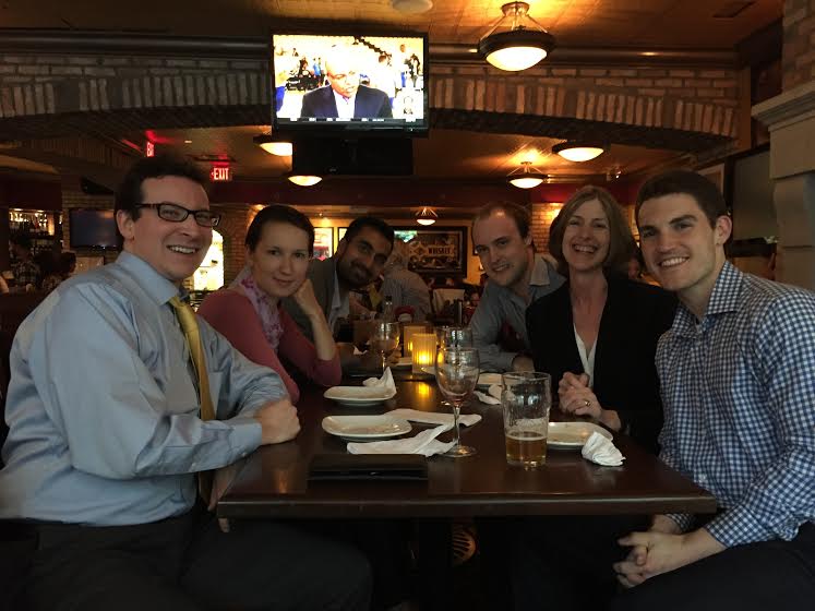 Patrick J. Healy with colleagues at a team dinner